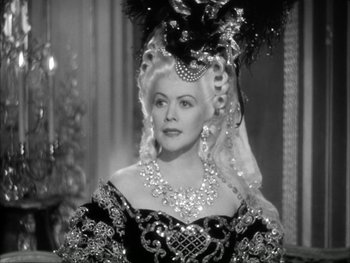 Movie still from “Marie Antoinette” (1938), directed by Julien Duvivier – A black and white photo of a woman in a costume; Close Up shot, Over the shoulder angle