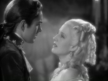 Movie still from “Marie Antoinette” (1938), directed by Julien Duvivier – A man and a woman looking into each others eyes; Close Up shot, Over the shoulder angle
