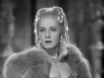 Movie still from “Marie Antoinette” (1938), directed by Julien Duvivier – An old photo of a woman in a fur coat; Close Up shot, Low angle