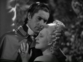 Movie still from “Marie Antoinette” (1938), directed by Julien Duvivier – A black and white photo of a man and a woman; Medium shot, High angle