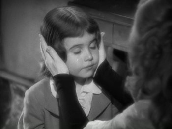 Movie still from “Marie Antoinette” (1938), directed by Julien Duvivier – A young girl is looking at her reflection in a mirror; Close Up shot, High angle