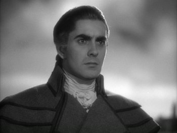 Movie still from “Marie Antoinette” (1938), directed by Julien Duvivier – A black - and - white photo of a man in a jacket; Close Up shot, Low angle
