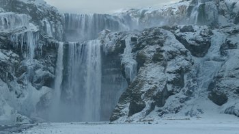 Movie still from “Game of Thrones” (2011), created by D.B. Weiss – A large waterfall with snow on it's side; Extreme Wide shot, Low angle