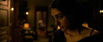 Movie still from “Extraction” (2020), directed by Sam Hargrave – A person looking down; Close Up shot, Over the shoulder angle