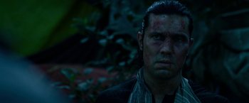 Movie still from “Extraction” (2020), directed by Sam Hargrave – A person wearing a jacket; Close Up shot, Low angle