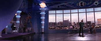 Movie still from “Mars Attacks!” (1996), directed by Tim Burton – A room that has some lights on the ceiling; Extreme Wide shot, High angle