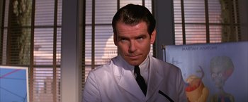 Movie still from “Mars Attacks!” (1996), directed by Tim Burton – A person wearing a suit and tie; Close Up shot, Low angle