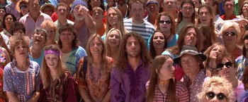 Movie still from “Mars Attacks!” (1996), directed by Tim Burton – A large group of people standing in front of each other; Medium shot, High angle