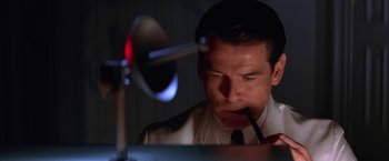 Movie still from “Mars Attacks!” (1996), directed by Tim Burton – A person holding a pencil; Close Up shot, Low angle