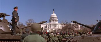 Movie still from “Mars Attacks!” (1996), directed by Tim Burton – A group of people standing in front of the capitol building; Extreme Wide shot, Low angle