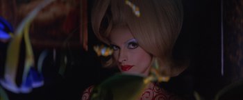 Movie still from “Mars Attacks!” (1996), directed by Tim Burton – A person wearing a wig; Close Up shot, Low angle
