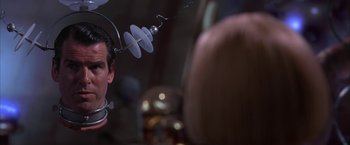 Movie still from “Mars Attacks!” (1996), directed by Tim Burton – A man with a microphone in his ear; Close Up shot, Over the shoulder angle