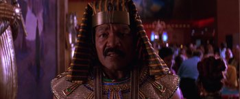 Movie still from “Mars Attacks!” (1996), directed by Tim Burton – An older man wearing a king's crown; Close Up shot, Low angle