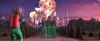 Movie still from “Mars Attacks!” (1996), directed by Tim Burton – A group of people standing next to each other in front of an explosion; Extreme Wide shot, High angle