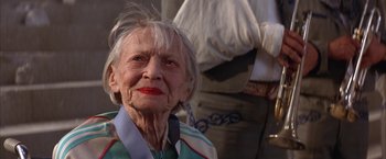 Movie still from “Mars Attacks!” (1996), directed by Tim Burton – An older woman with white hair and red lipstick; Close Up shot, Low angle