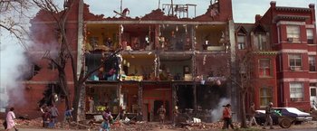 Movie still from “Mars Attacks!” (1996), directed by Tim Burton – A building that has been demolished and destroyed; Extreme Wide shot, Over the shoulder angle