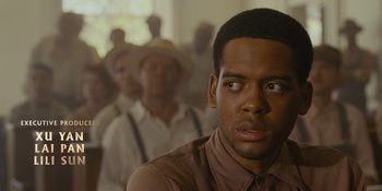 Movie still from “Marshall” (2017), directed by Reginald Hudlin – A group of men standing next to each other in a room; Close Up shot, Over the shoulder angle