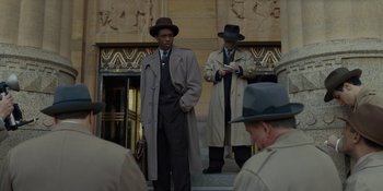 Movie still from “Marshall” (2017), directed by Reginald Hudlin – A group of men standing next to each other on steps; Medium shot, Low angle