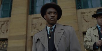Movie still from “Marshall” (2017), directed by Reginald Hudlin – A man wearing a hat and a coat; Close Up shot, Low angle