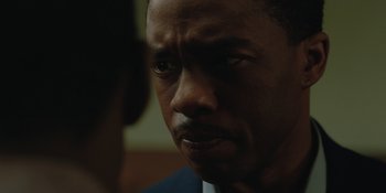 Movie still from “Marshall” (2017), directed by Reginald Hudlin – A person looking at the camera; Close Up shot, Over the shoulder angle