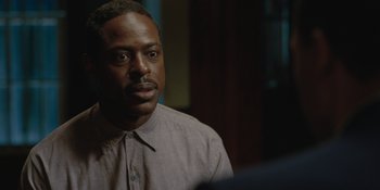 Movie still from “Marshall” (2017), directed by Reginald Hudlin – A man in a brown shirt is looking at the camera; Close Up shot, Over the shoulder angle