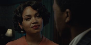 Movie still from “Marshall” (2017), directed by Reginald Hudlin – A woman with a red shirt and a man with a black suit; Close Up shot, Over the shoulder angle