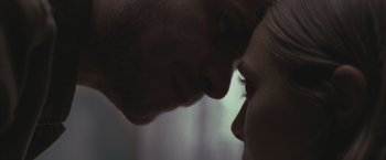 Movie still from “Martha Marcy May Marlene” (2011), directed by Sean Durkin – A man and a woman face to face in the dark; Extreme Close Up shot, Over the shoulder angle