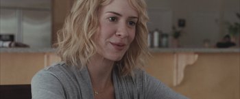 Movie still from “Martha Marcy May Marlene” (2011), directed by Sean Durkin – A person with blonde hair; Close Up shot, Over the shoulder angle