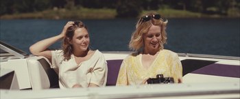Movie still from “Martha Marcy May Marlene” (2011), directed by Sean Durkin – Two women sitting on a boat in the water; Medium shot, Over the shoulder angle