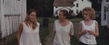 Movie still from “Martha Marcy May Marlene” (2011), directed by Sean Durkin – Two young women are walking in a field; Medium shot, Over the shoulder angle