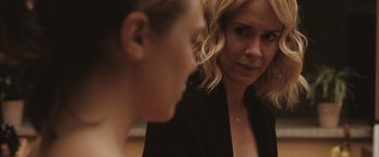 Movie still from “Martha Marcy May Marlene” (2011), directed by Sean Durkin – A woman looking at another woman in the mirror; Close Up shot, Over the shoulder angle