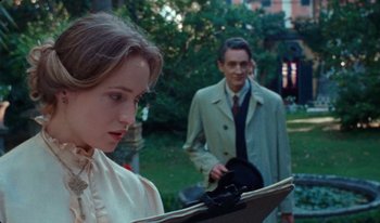 Movie still from “Martin Eden” (2019), directed by Pietro Marcello – A man and a woman looking at a clipboard; Close Up shot, Over the shoulder angle