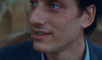 A man's face with blue eyes