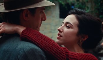 Movie still from “Martin Eden” (2019), directed by Pietro Marcello – A man and a woman are hugging each other; Close Up shot, Over the shoulder angle