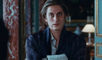 Movie still from “Martin Eden” (2019), directed by Pietro Marcello – A person with long hair; Close Up shot, Low angle