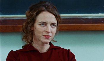 Movie still from “Martin Eden” (2019), directed by Pietro Marcello – A person wearing a red shirt; Close Up shot, Over the shoulder angle