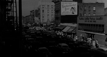 Movie still from “Marty” (1955), directed by Delbert Mann – A black and white photo of a busy city street; Extreme Wide shot, High angle