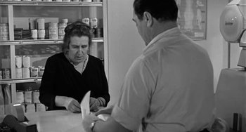 Movie still from “Marty” (1955), directed by Delbert Mann – An older woman and a man are looking at each other; Medium shot, Over the shoulder angle