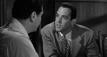 Movie still from “Marty” (1955), directed by Delbert Mann – A man in a suit talking to another man in a suit; Close Up shot, Over the shoulder angle