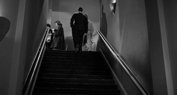 Movie still from “Marty” (1955), directed by Delbert Mann – A group of people walking up a set of stairs; Wide shot, High angle
