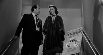 Movie still from “Marty” (1955), directed by Delbert Mann – A man and a woman standing next to each other; Medium shot, Low angle