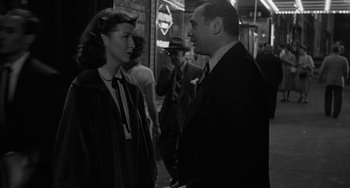 Movie still from “Marty” (1955), directed by Delbert Mann – A man and a woman talking to each other on the street; Medium shot, Over the shoulder angle