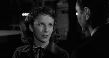 Movie still from “Marty” (1955), directed by Delbert Mann – A woman in a black jacket and a man in a black jacket; Close Up shot, Over the shoulder angle