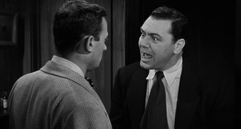 Movie still from “Marty” (1955), directed by Delbert Mann – Two men in suits and ties one of which is angry at the other; Close Up shot, Over the shoulder angle
