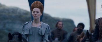 Movie still from “Mary Queen of Scots” (2018), directed by Josie Rourke – A woman standing in front of two men; Medium shot, Low angle