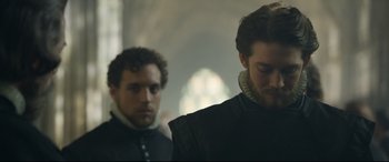 Movie still from “Mary Queen of Scots” (2018), directed by Josie Rourke – Two men standing next to each other in a room; Close Up shot, Over the shoulder angle