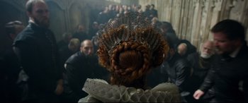 Movie still from “Mary Queen of Scots” (2018), directed by Josie Rourke – A person wearing a crown; Close Up shot, Over the shoulder angle