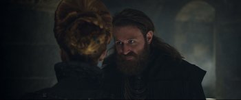 Movie still from “Mary Queen of Scots” (2018), directed by Josie Rourke – A man with long hair and a long beard looking at another man with long hair; Close Up shot, Over the shoulder angle