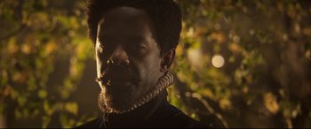 Movie still from “Mary Queen of Scots” (2018), directed by Josie Rourke – A person wearing a necklace; Close Up shot, Over the shoulder angle