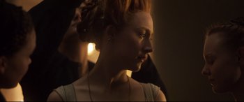 Movie still from “Mary Queen of Scots” (2018), directed by Josie Rourke – A person wearing a necklace; Close Up shot, Over the shoulder angle